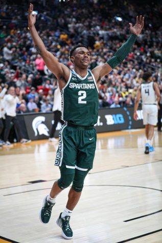 Tyson Walker looks to the crowd as Michigan State put the finishing touches on an upset win over Marquette in the Second Round of NCAA Tournament on March 19, 2023. Photo Credit: Sarah Smith/WDBM
