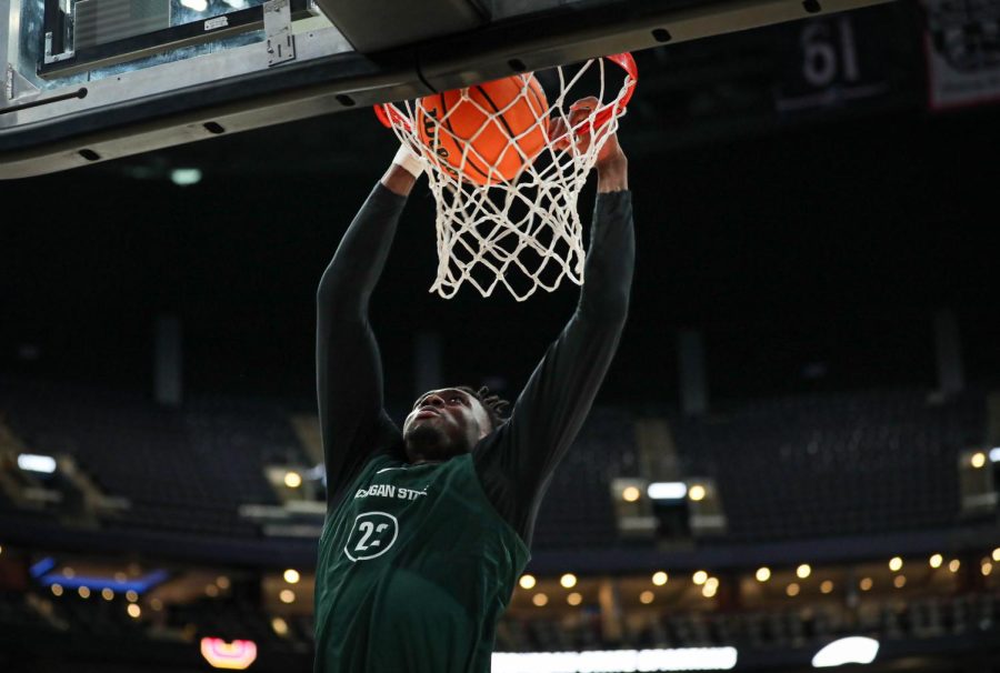 Mady Sissoko dunks the ball during Michigan States open practice in Columbus on March 16, 2023. Photo Credit: Sarah Smith/WDBM