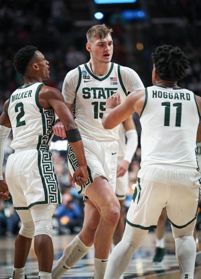 Carson Cooper celebrates with teammates during Michigan States 72-62 victory over USC in the first round of the NCAA Tournament on March 17, 2023. Photo Credit: Sarah Smith/WDBM