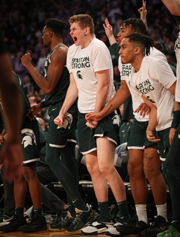 Jaxon Kohler and the Michigan State bench celebrate a big play during Michigan States overtime loss to Kansas State in the Sweet Sixteen on March 23, 2023. Photo Credit: Sarah Smith/WDBM