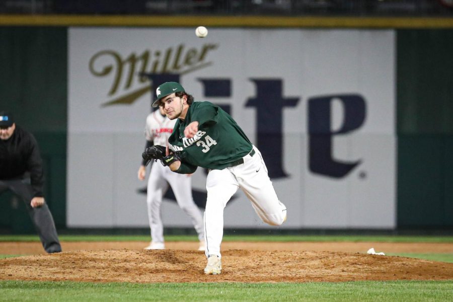 Max Chapman pitches the ball during the Crosstown Showdown on April 4, 2023. Photo Credit: Sarah Smith/WDBM