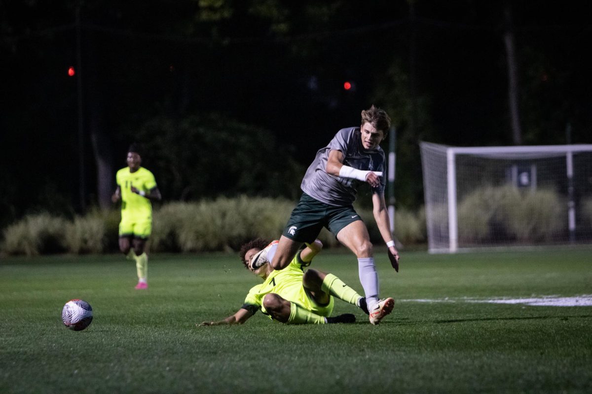 Michigan State freshman forward Richie Ludwig runs past an Oakland defender at DeMartin Stadium on Tuesday, September 26, 2023.