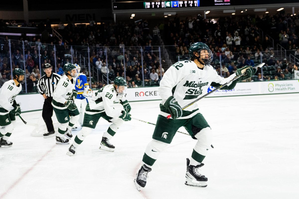 MSU sophomore forward Isaac Howard (22) celebrates a goal against Lake Superior State on Saturday, October 7, 2023 at Munn Ice Arena.