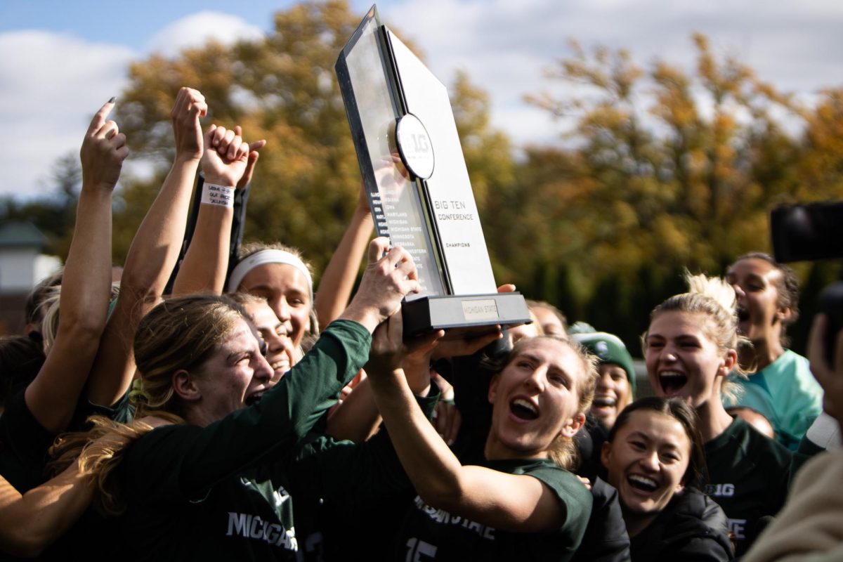 The+MSU+Womens+Soccer+team+raises+the+Big+Ten+championship+trophy+after+earning+a+share+of+the+regular+season+championship+for+a+second+straight+year+with+a+win+over+Iowa+on+Sunday%2C+October+22%2C+2023+at+DeMartin+Stadium.