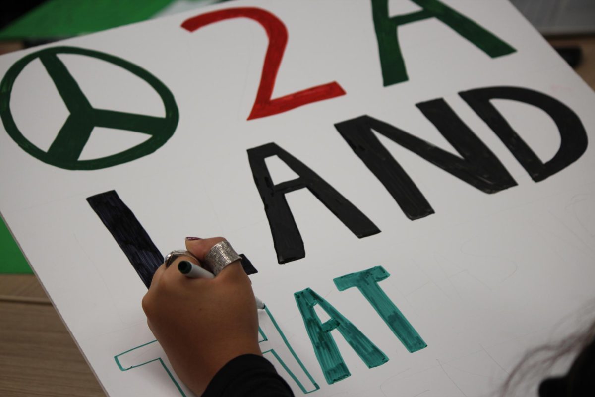 Students create signs in preparation for tomorrows protest. Photo Credit: Sophia Deiters/WDBM