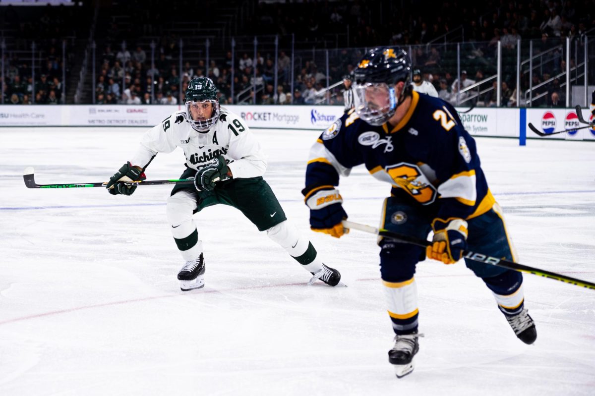 MSU fifth-year forward Nicolas Müller tracks the puck against Canisius on Thursday, October 19, 2023 at Munn Ice Arena.