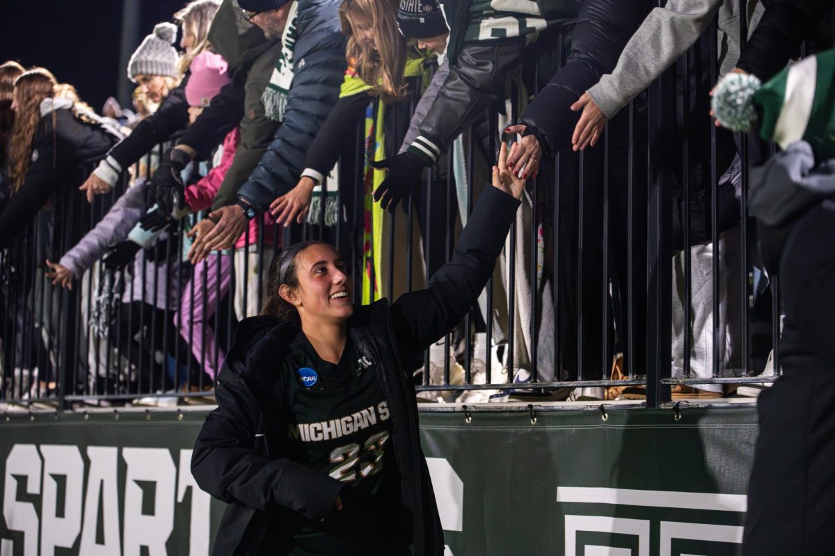 MSU freshman forward/midfielder Bella Najera celebrates with Spartan fans after scoring two goals in a win against Ohio in the NCAA tournament on Friday, November 10, 2023 at DeMartin Stadium.