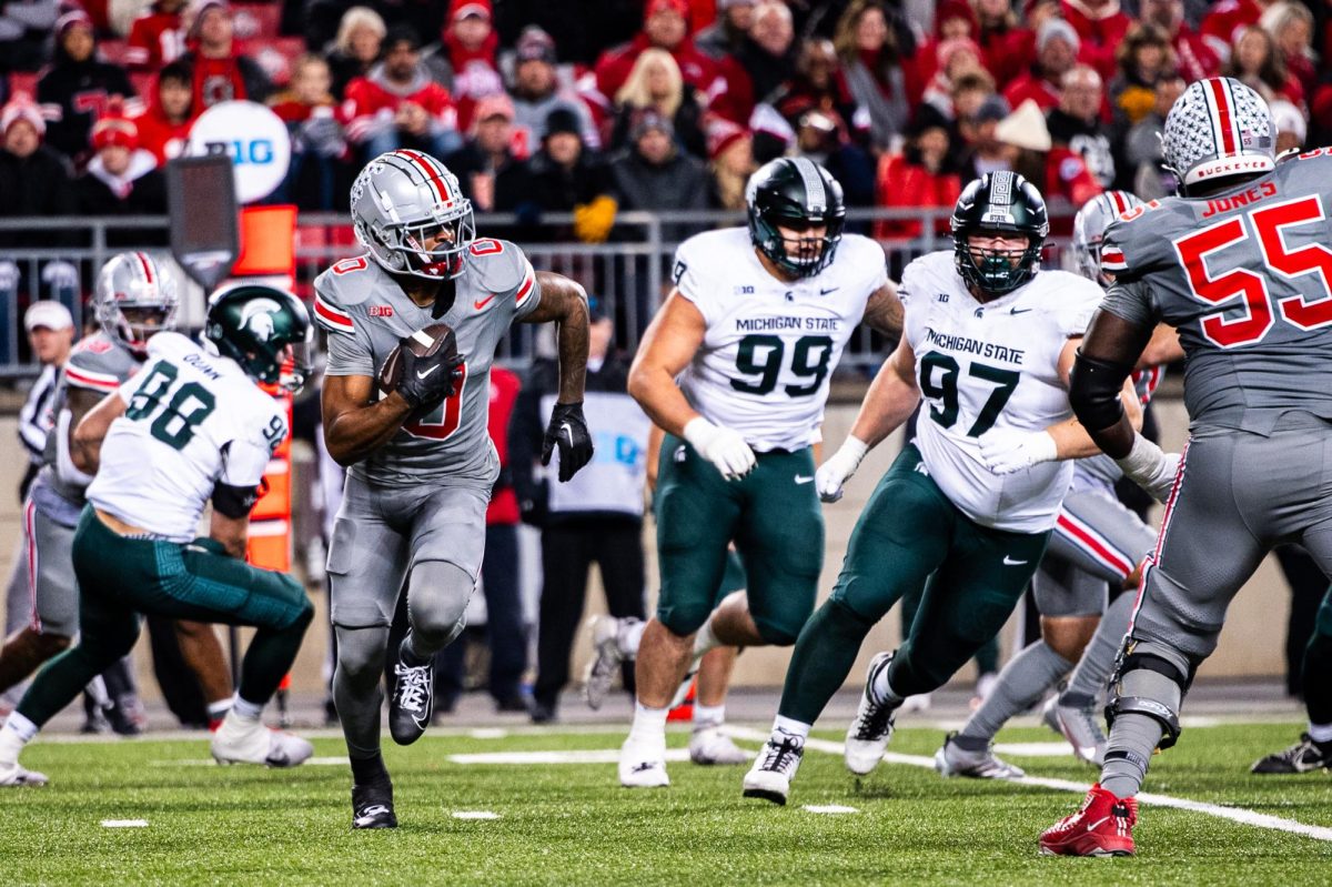 Ohio State graduate running back Xavier Johnson rushes against MSU on Saturday, November 11, 2023 at Ohio Stadium.