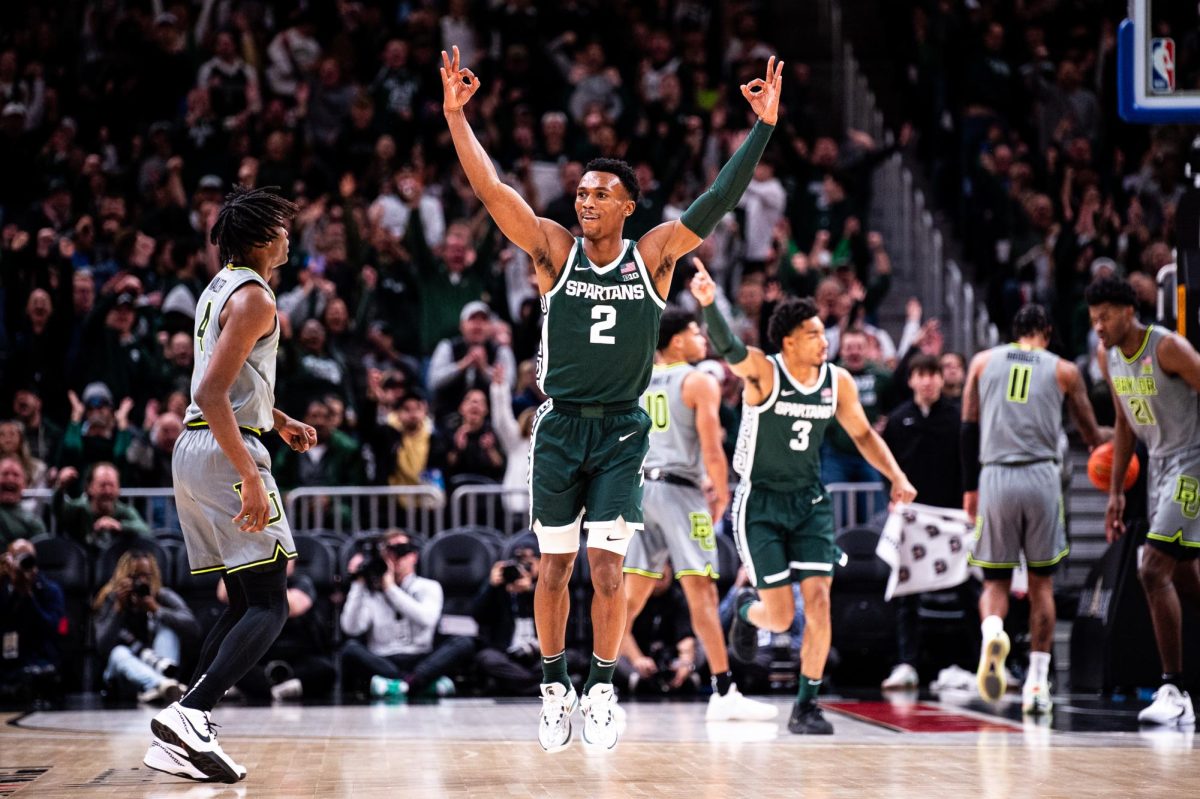 MSU graduate guard Tyson Walker celebrates after hitting a three-pointer against Baylor on Saturday, December 16, 2023 at Little Caesars Arena.