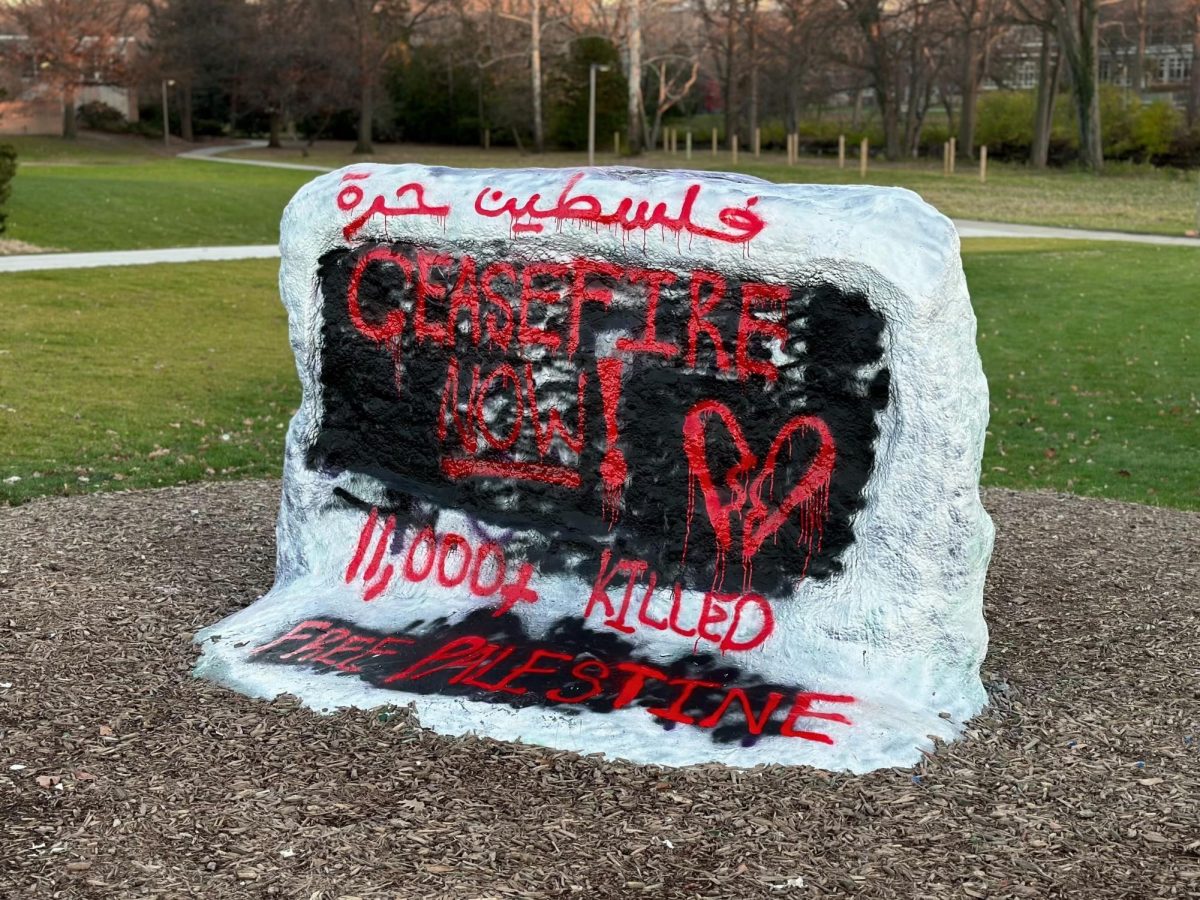 MSU students painted The Rock to show support for a ceasefire in Gaza. Photo Credit: Catherine Grumish/WDBM

