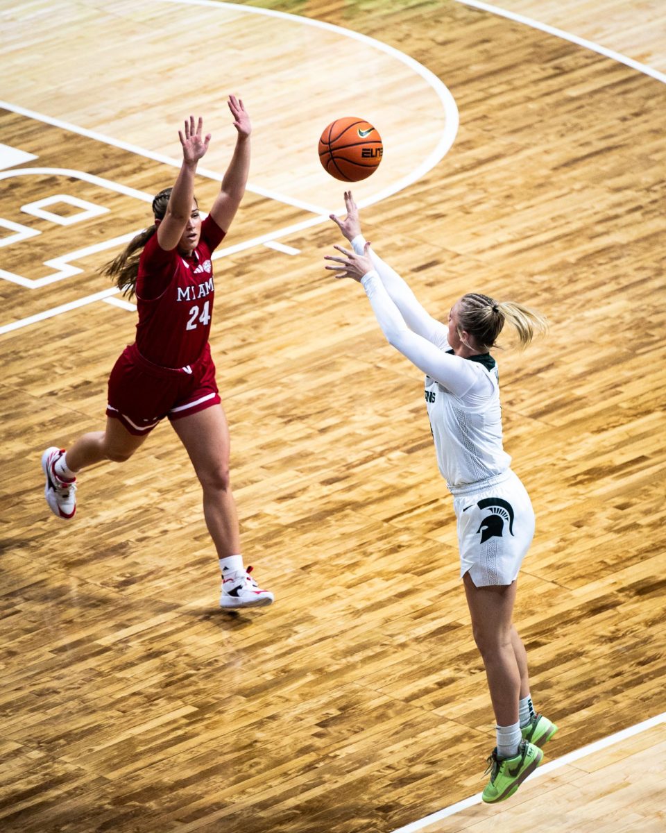 MSU sophomore guard Theryn Hallock sinks a three-pointer against Miami (OH) on Sunday, December 3, 2023 at the Breslin Center.