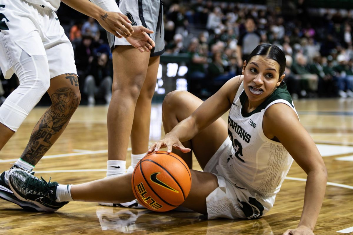 MSU graduate guard Moira Joiner is helped up after being fouled by Purdue on Wednesday, Jan. 24, 2023 at the Breslin Center.