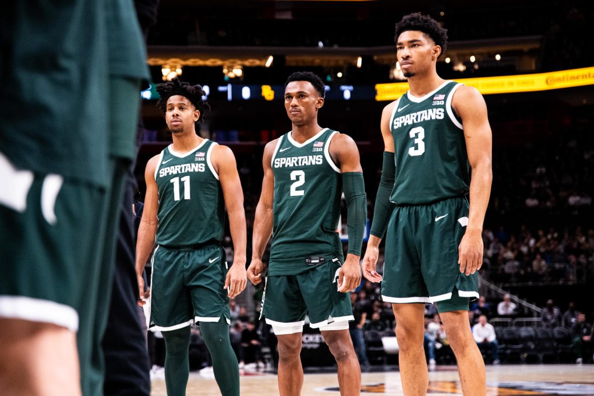 MSU senior guard A.J. Hoggard (11) is introduced along with graduate guard Tyson Walker (2) and junior guard Jaden Akins in the MSU starting lineup ahead of the matchup against Baylor on Friday, December 16, 2023 at Little Caesars Arena.