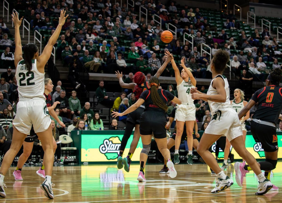 MSU sophomore guard Theryn Hallock (4) fires a three-pointer against Maryland on Tuesday, January 9, 2024 at the Breslin Center.
