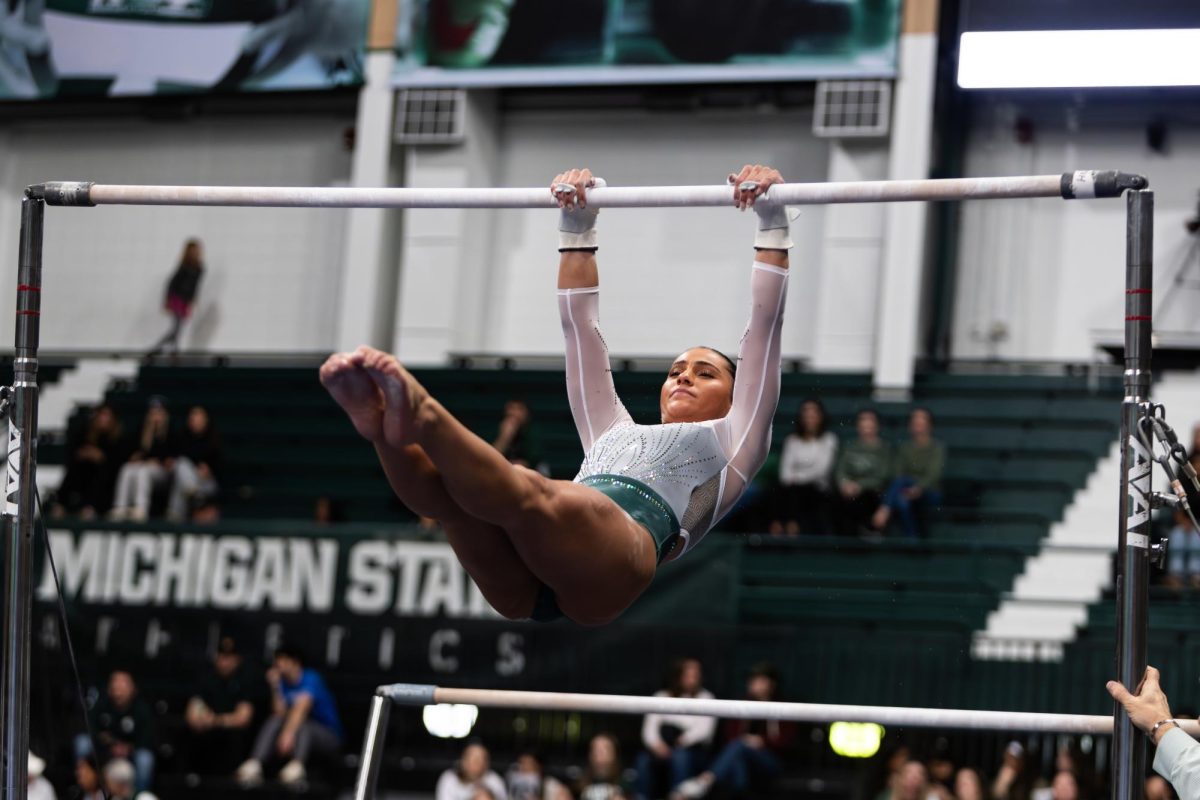 MSU senior Delanie Harkness led the Spartans on bars with a score of 9.925 against no. 25 Illinois on Friday, Feb. 9, 2024 at Jenison Field House. (Avery Kotel)