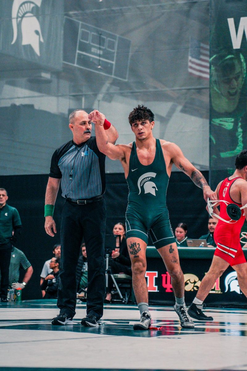 MSU senior Chase Saldate celebrates a victory during a match against Ohio State on Friday, Feb. 16, 2024 at Jenison Field House. 