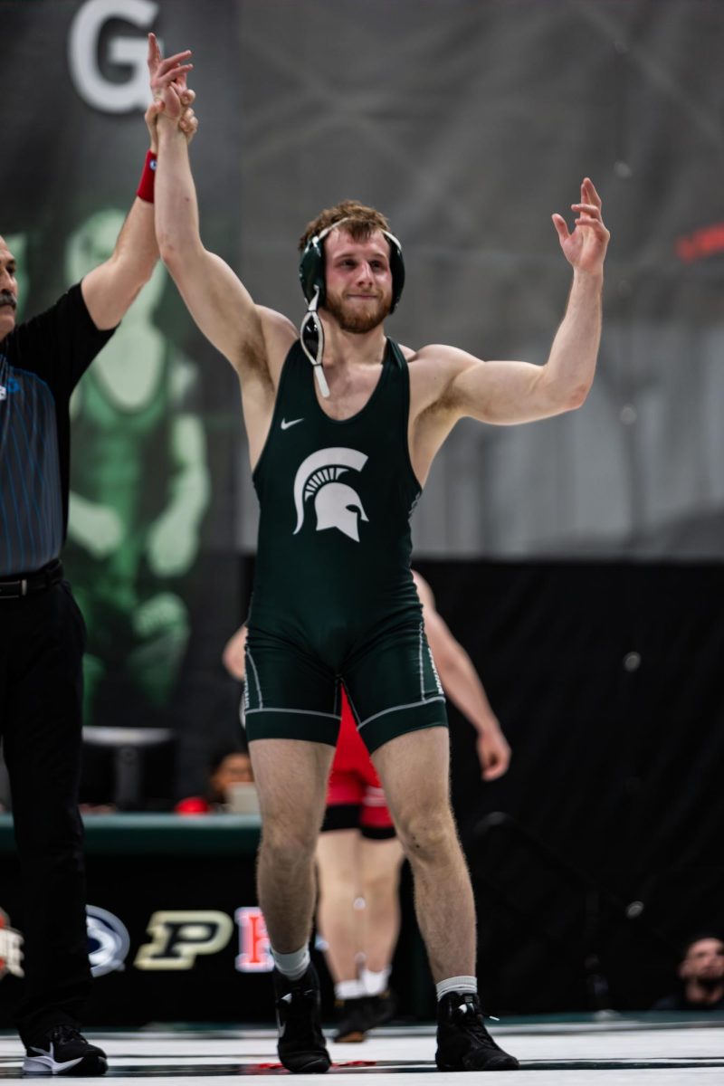 MSU senior Caleb Fish tangles with an opponent from Ohio State on Friday, Feb. 16, 2024 at Jenison Field House. ()