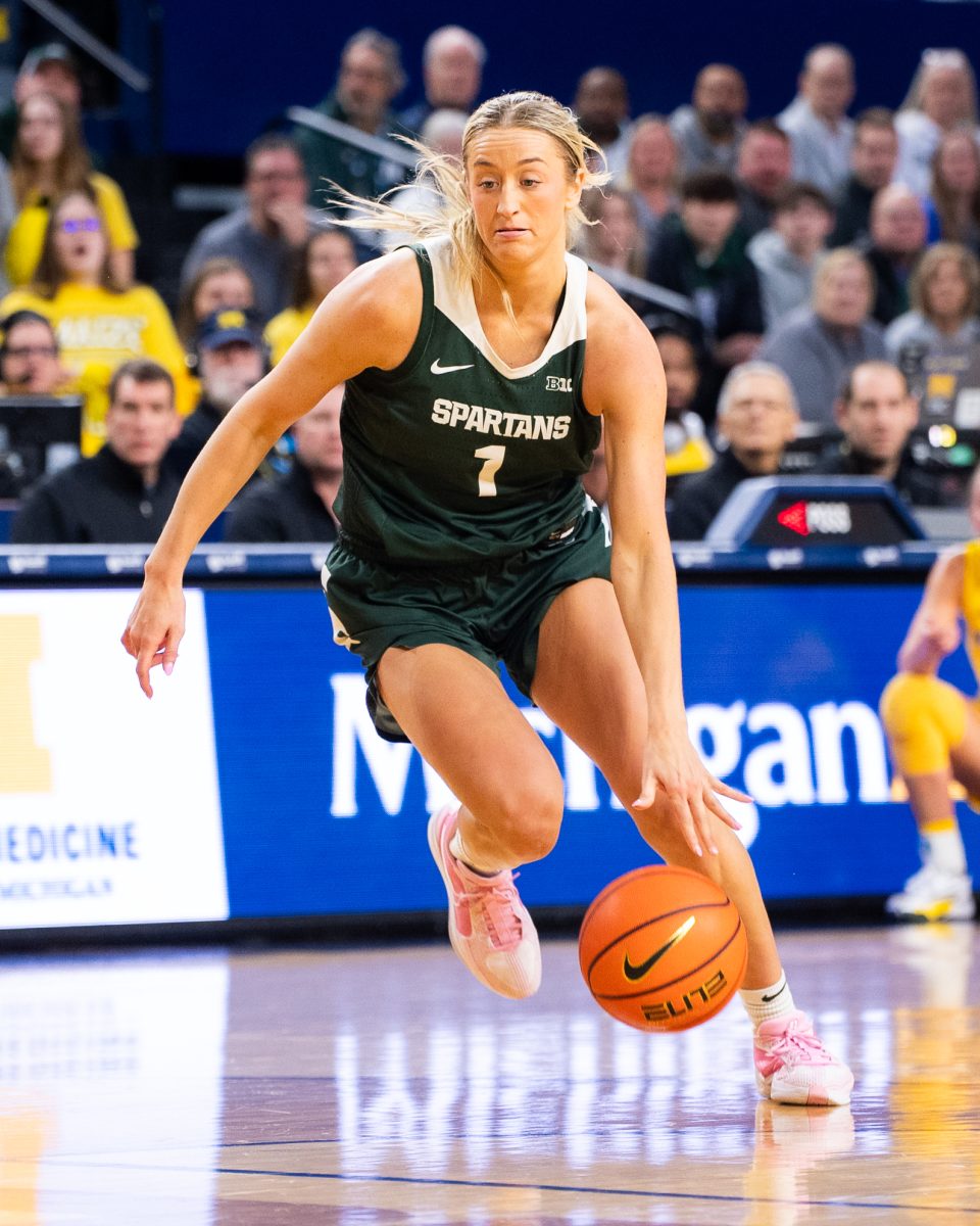 MSU graduate forward Tory Ozment drives into the lane against Michigan on Sunday, Feb. 18, 2024 at the Crisler Center in Ann Arbor.