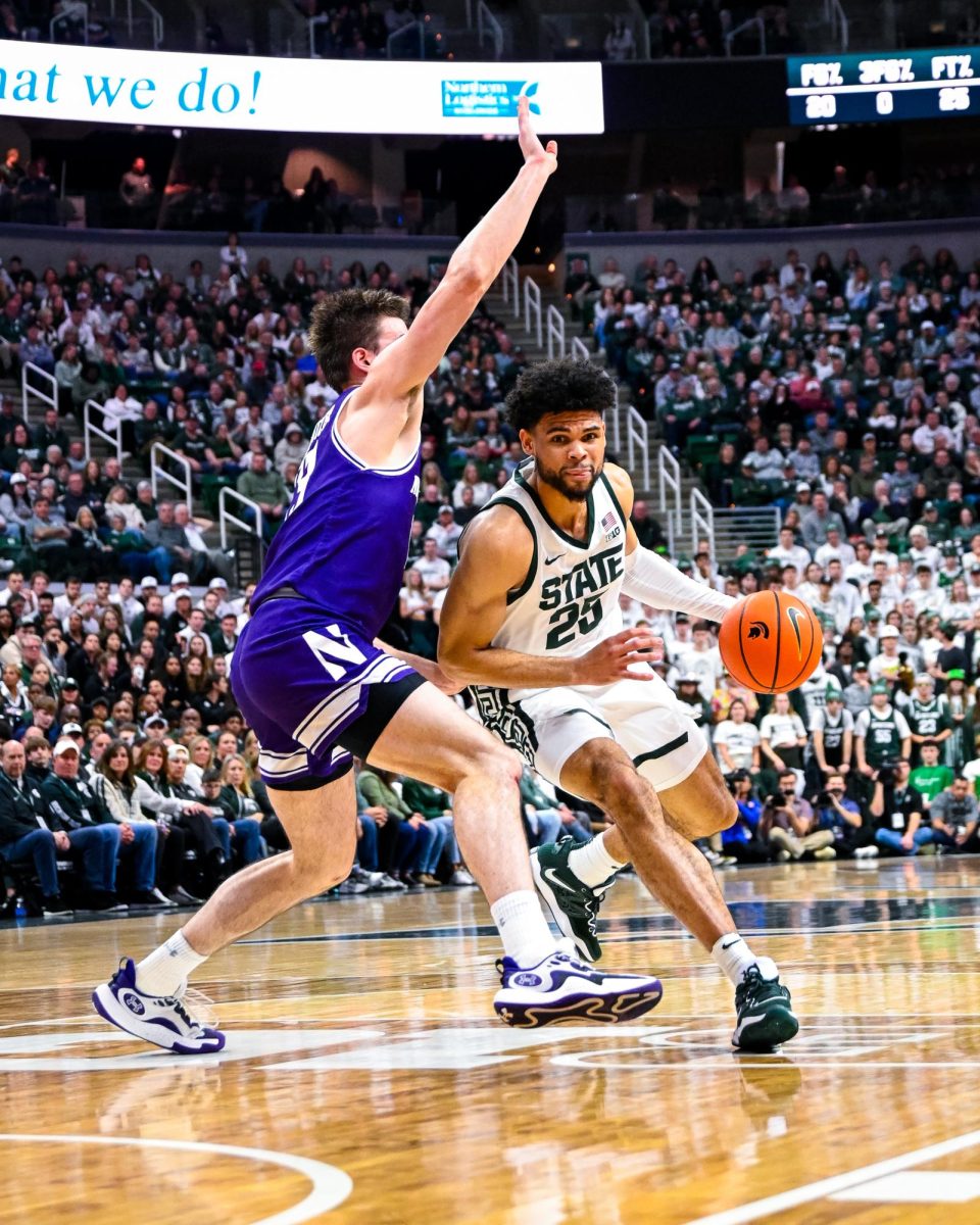 MSU graduate forward Malik Hall (25) drives to the basket against Northwestern on Senior Night on Wednesday, Mar. 6, 2024 at the Breslin Center. 