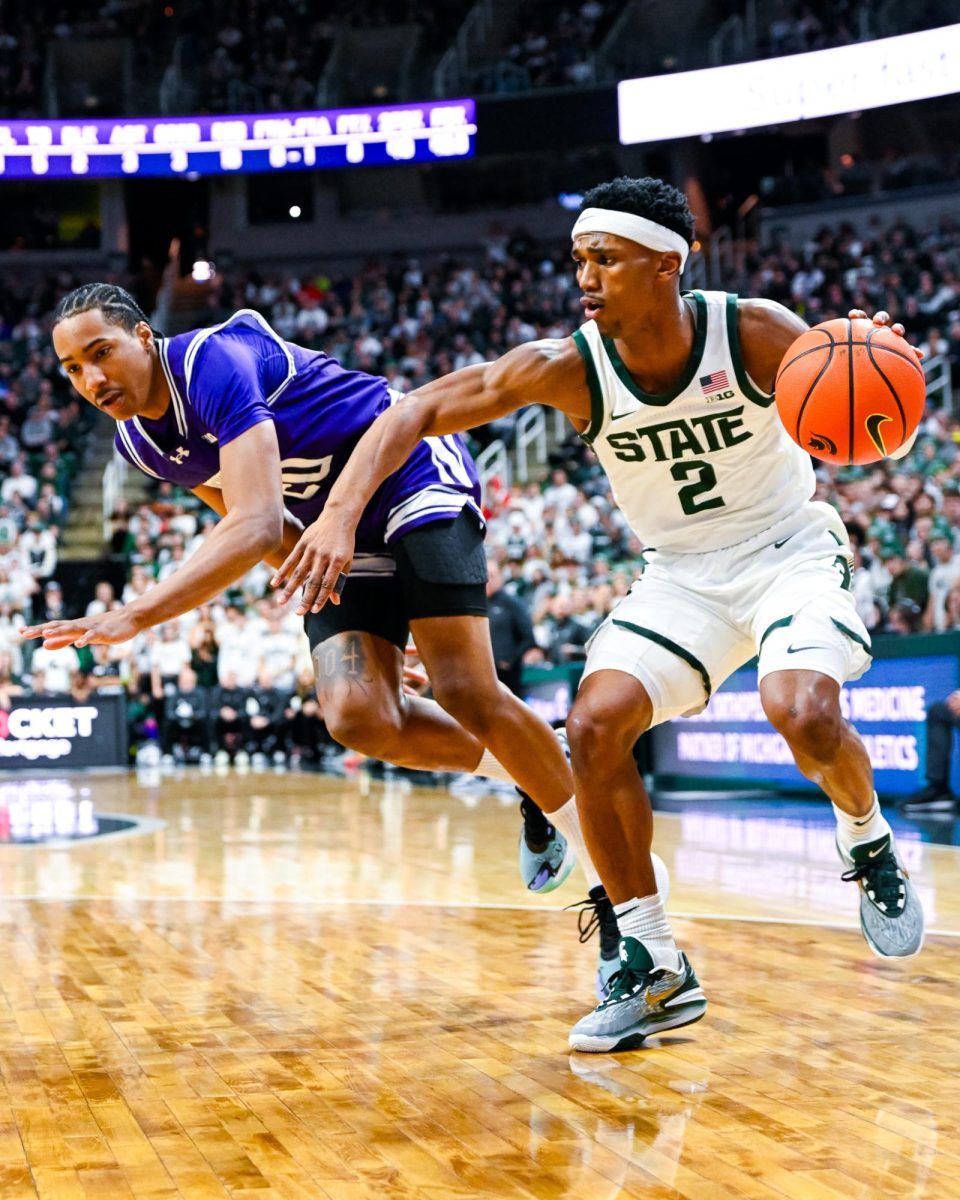 MSU graduate guard Tyson Walker (right) loses the Northwestern defender on Wednesday, Mar. 6, 2024 at the Breslin Center. 