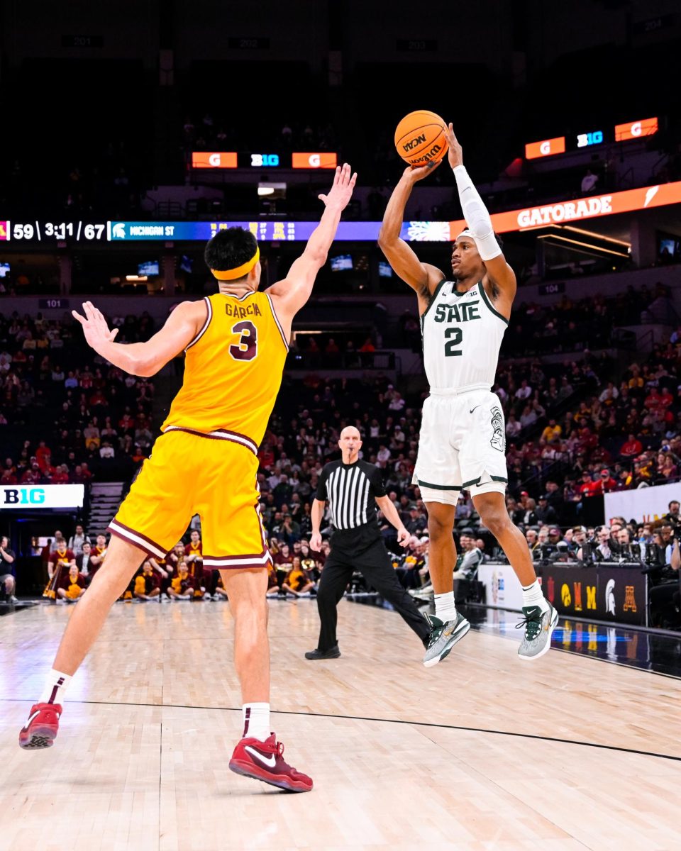 MSU graduate guard Tyson Walker (2) sinks a midrange jump shot late in the second half of MSUs 77-67 victory over Minnesota in the B1G Mens Basketball Tournament on Thursday, Mar. 14, 2024 at the Target Center in Minneapolis, MN.

(Photo by Jack Moreland/WDBM Sports/Michigan State University)