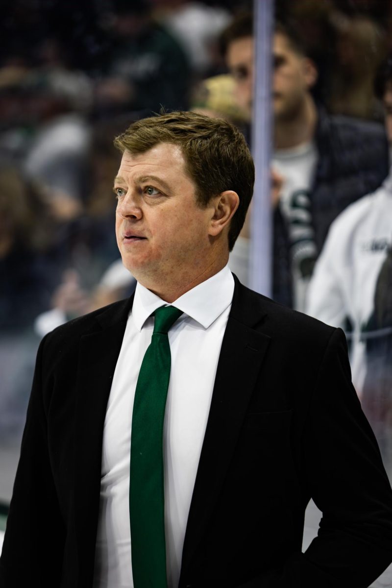 MSU Head Coach Adam Nightingale looks on during his teams 5-4 overtime victory over Michigan for the B1G Tournament Championship on Saturday, Mar. 23, 2024 at Munn Ice Arena. (Avery Kotel)