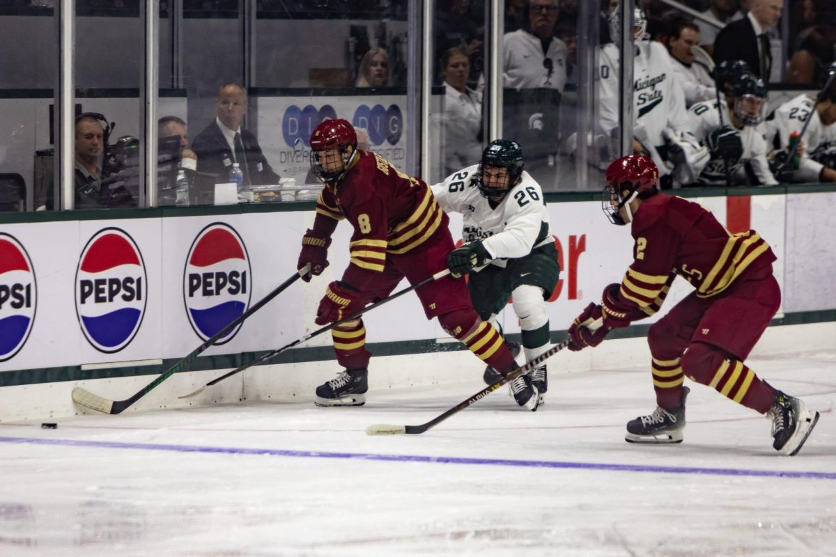 MSU hockey's Tanner Kelly battles with Boston College at Munn Ice Arena (East Lansing, Oct. 12 2024).