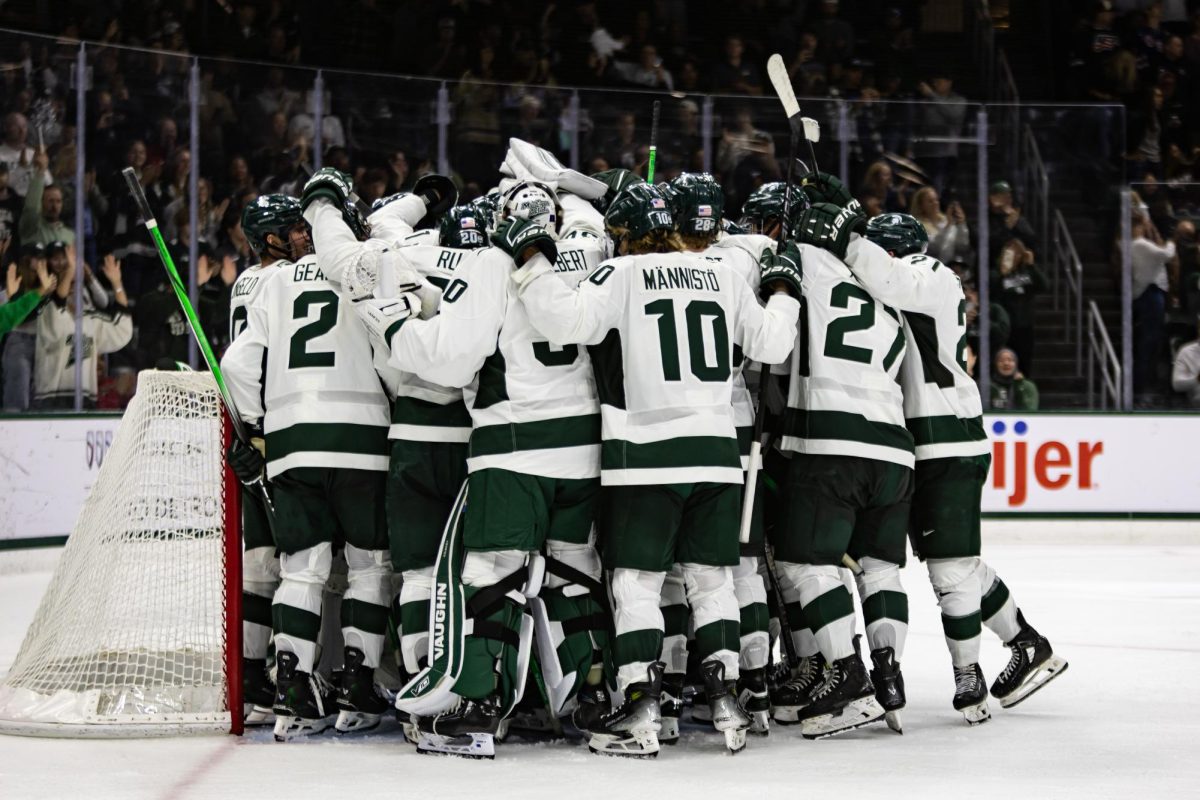 MSU hockey celebrates after first win against Boston College since 2007. (East Lansing, Oct. 12, 2024)