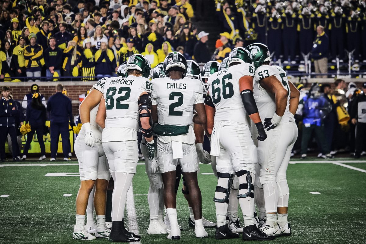 MSU football team huddle versus Michigan on Oct. 26