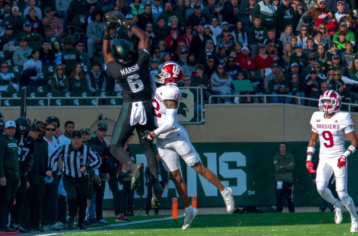 MSU WR Nick Marsh jumps for a pass against Indiana (East Lansing, Nov. 2 2024)