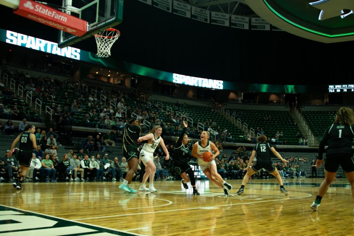 MSU guard Theryn Hallock drives to the rim in MSU's dominant victory over Eastern Michigan (East Lansing, Nov. 11, 2024).