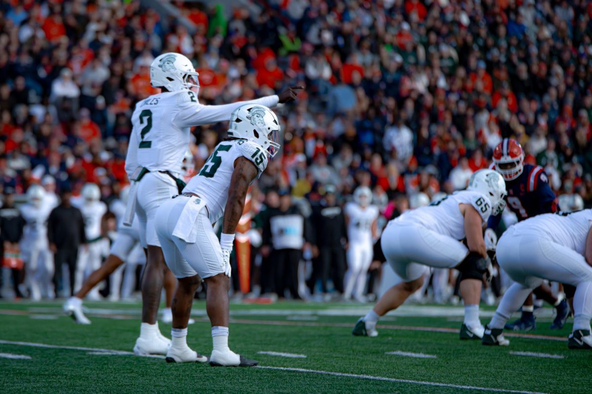 MSU QB Aidan Chiles directs offense during the Spartans matchup versus Illinois (Champaign, Ill., Nov. 16 2024)