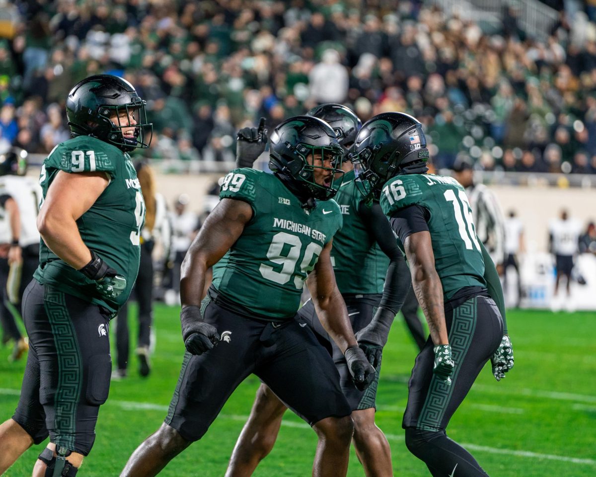 Freshman defensive back Jaylen Thompson (right), sixth-year defensive lineman Quindarius Dunnigan (middle) and redshirt sophomore defensive lineman Alex VanSumeren (left) versus Purdue on Nov. 22, 2024 at Spartan Stadium. 