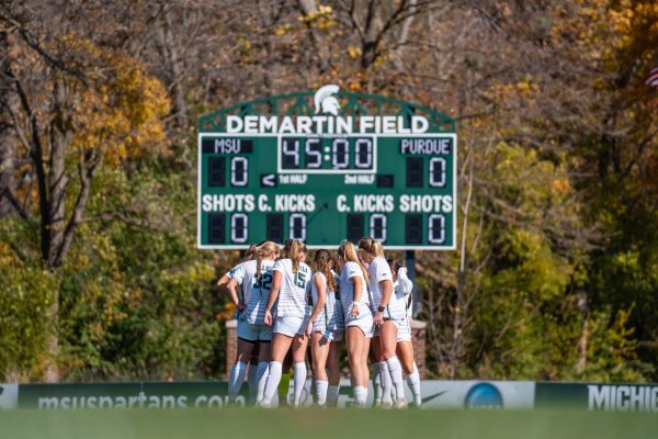 MSU women's soccer team huddled versus Purdue on Oct. 27, 2024 at DeMartin Stadium