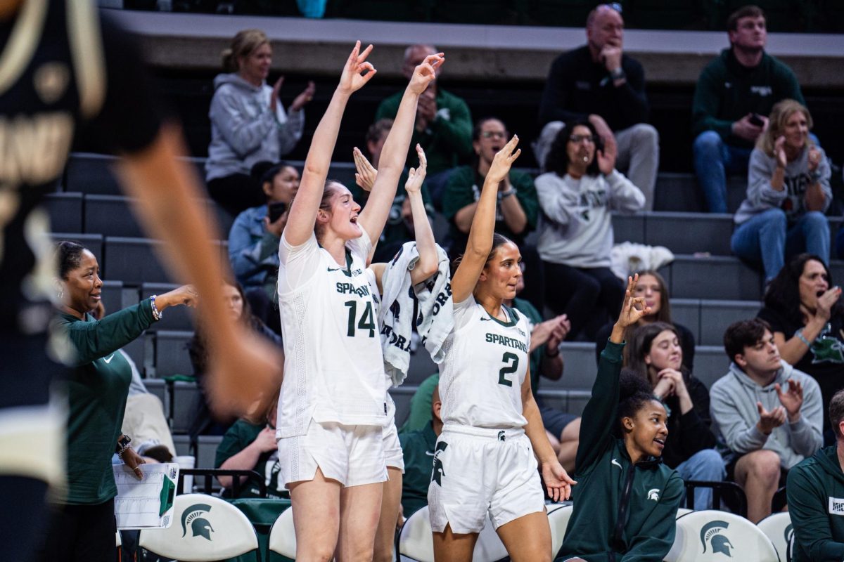 MSU women's basketball team celebrates after making a three-pointer in their victory over Oakland (East Lansing, Nov. 5, 2024).