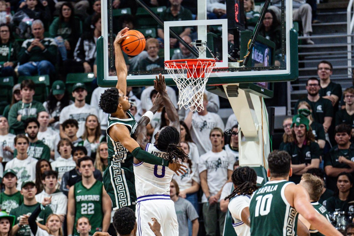 MSU guard Jaden Aikens throws down a massive poster dunk in MSUs victory over Niagara (East Lansing, Nov. 7 2024). 