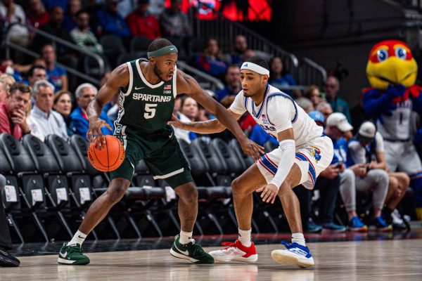 MSU junior guard Tre Holloman matched up against Kansas graduate guard Dajuan Harris Jr. on Nov. 12 at the 2024 State Farm Champions Classic.