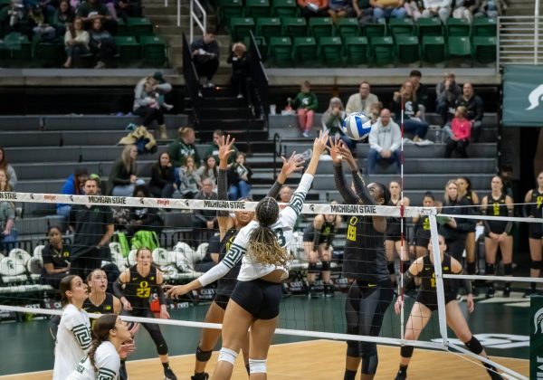 MSU senior outside hitter Aliyah Moore tipping the ball across the net versus No. 13 Oregon on Nov. 21. 