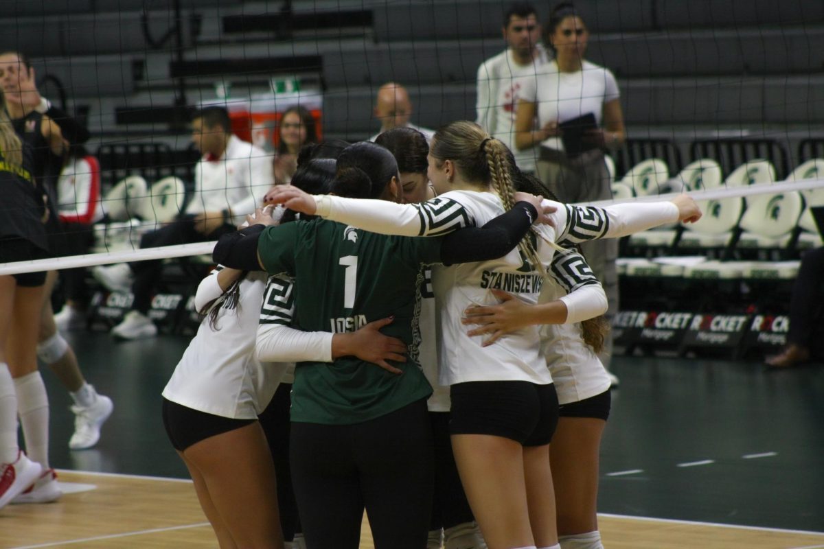 MSU volleyball team huddle versus Maryland on Nov. 23, 2024 at the Breslin Center. 