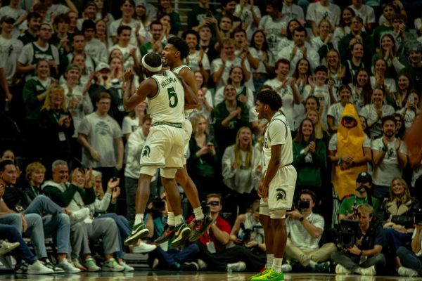 MSU junior guard Tre Holloman and senior guard Jaden Akins jumping up to celebrate versus Samford on Nov. 20, 2024. Freshman guard Jase Richardson on the right. 