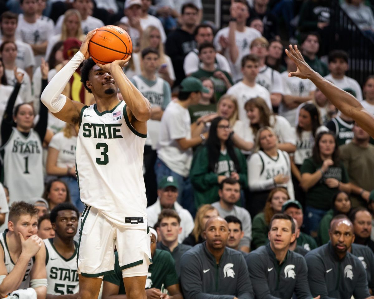 MSU guard Jaden Aikens lines up a three-pointer in the Spartans season opener versus Monmouth (East Lansing, Nov. 4, 2024).