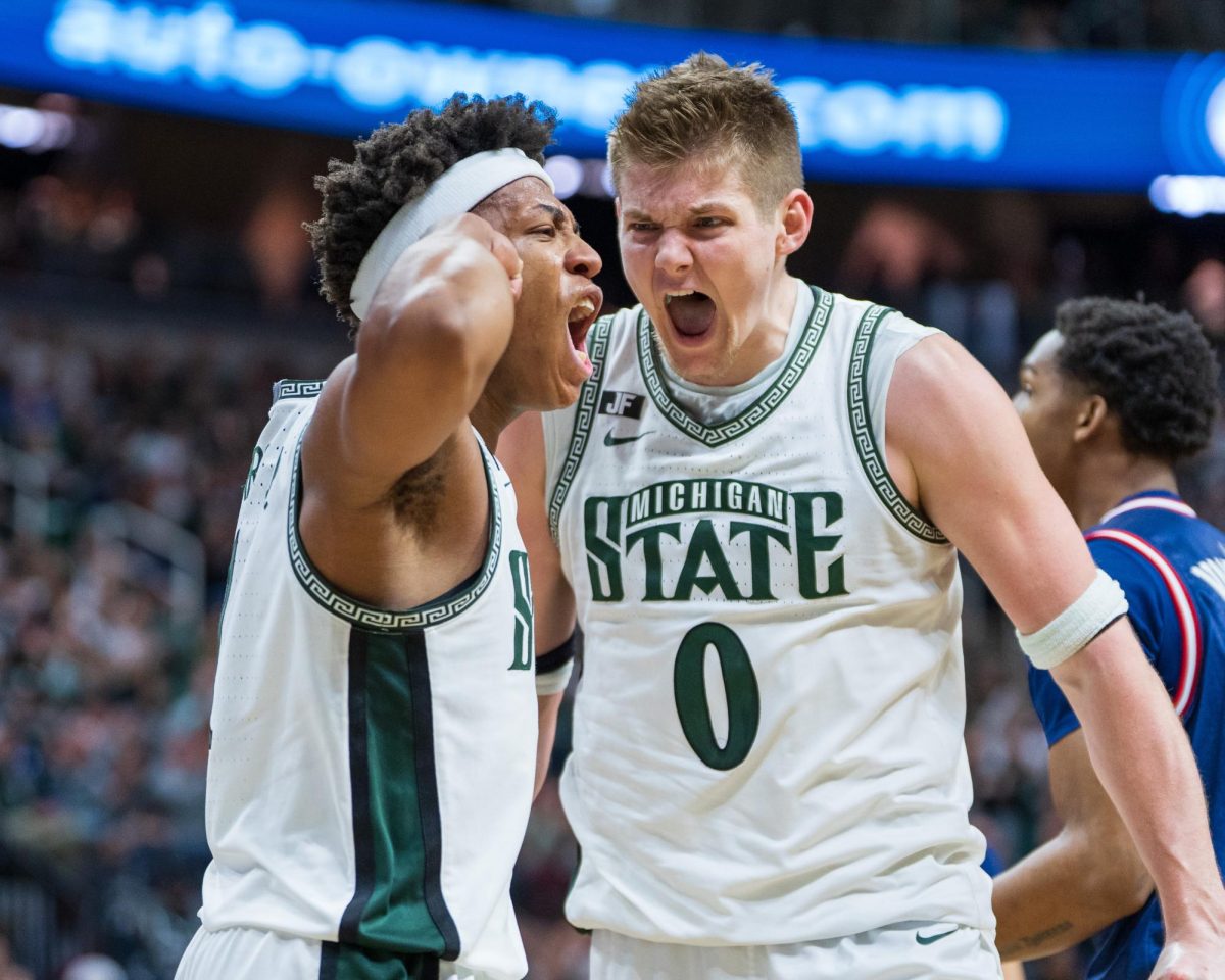 MSU redshirt-freshman Jeremy Fears Jr. and junior forward Jaxon Kohler celebrate during MSU's dominant win over FAU (East Lansing, Dec. 21 2024).