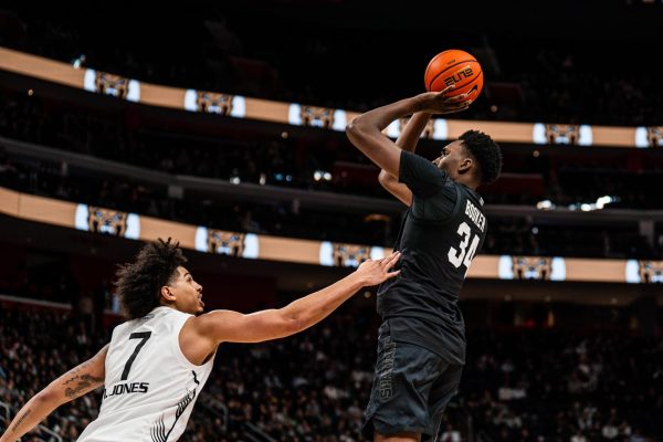 MSU forward Xaiver Booker pulls up for a jumper en route to a career-high 18-points in MSUs battle in Detroit against Oakland (Detroit, Dec. 17 2024).