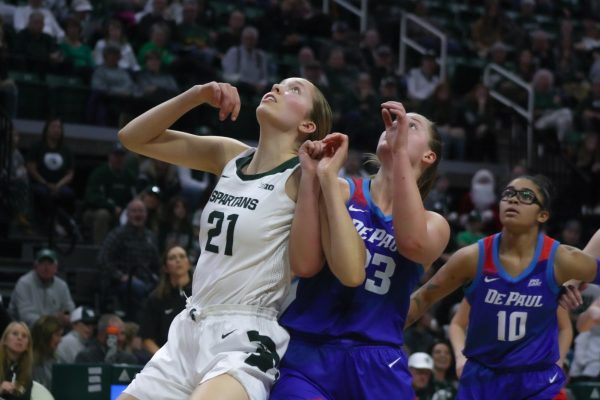 MSU center Mary Meng, DePaul forward Jorie Allen (center) and guard Haley Walker (right). (East Lansing, Dec. 8, 2024)