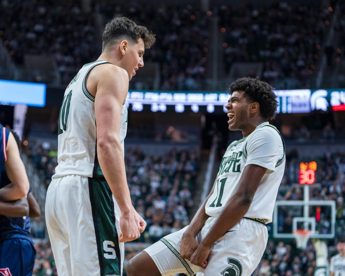 MSU senior center Szymon Zapala (left) and freshman guard Jase Richardson (right) celebrate versus FAU (East Lansing, Dec. 21 2024).