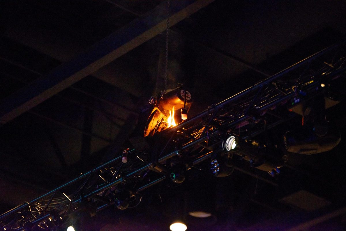 A small fire burns in a light fixture at the Lansing Center during the MLK Day of Celebration Luncheon. The fire was extinguished and the event resumed as normal. Photo credit: Will McKarns/WDBM