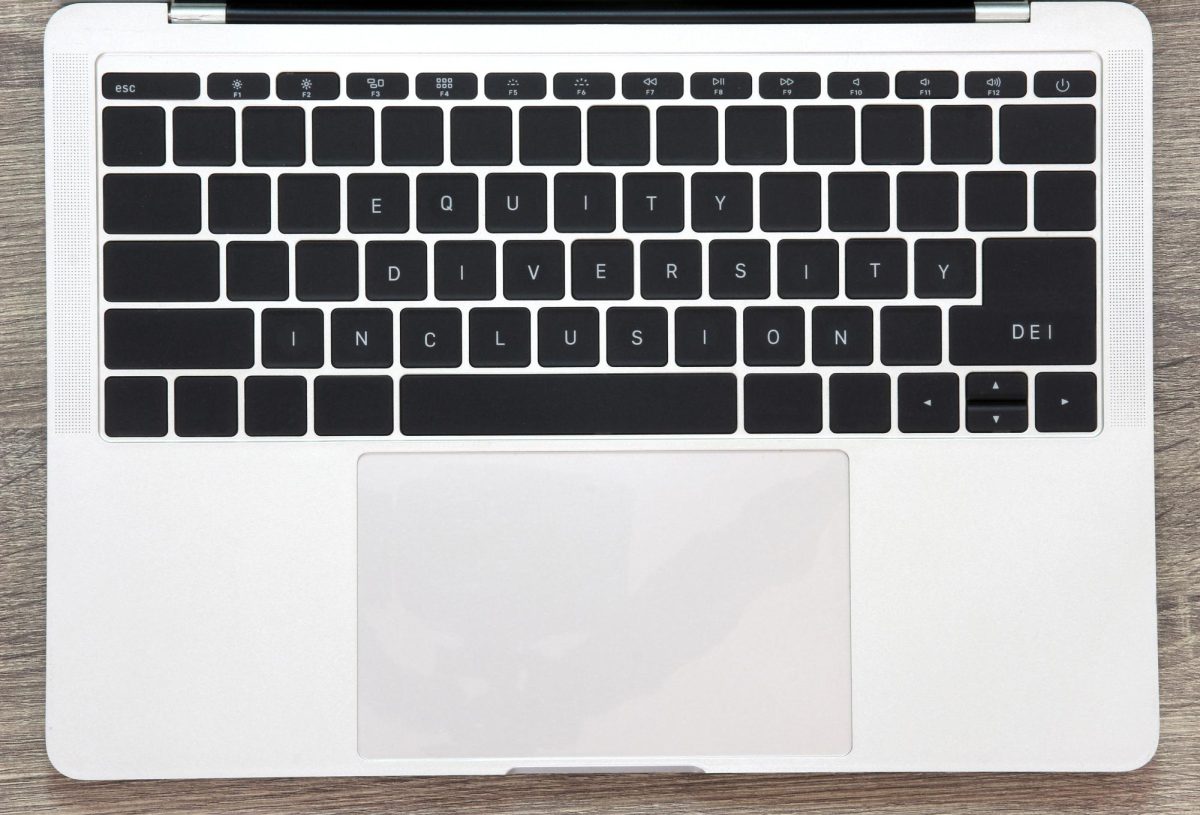 A laptop keyboard where the visible keys spell out “equity, diversity and inclusion”. Stock photos by Vecteezy.