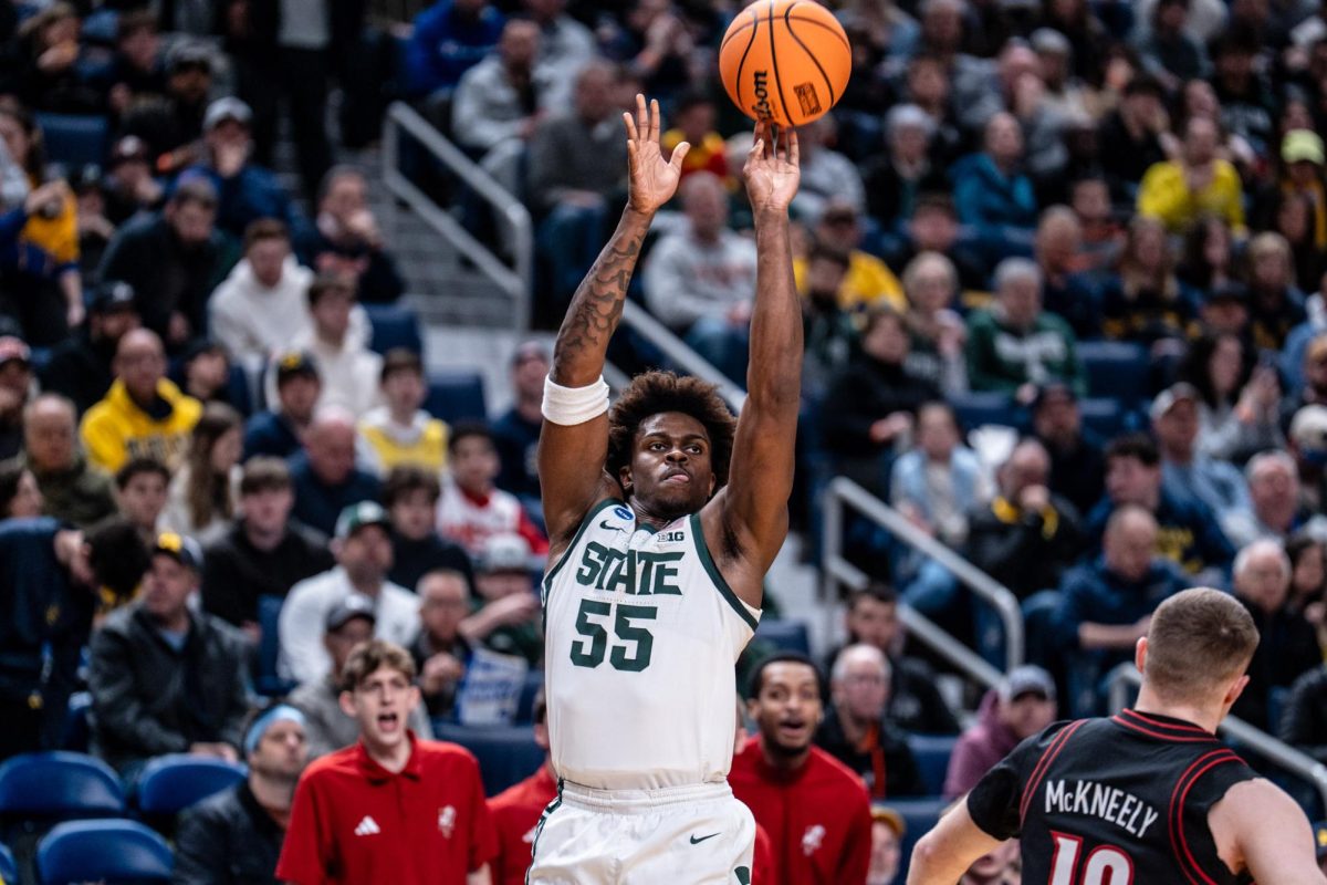 Michigan State forward Coen Carr shoots a three-pointer against Louisville in the NCAA Tournament. (Buffalo, N.Y., March 21, 2026)